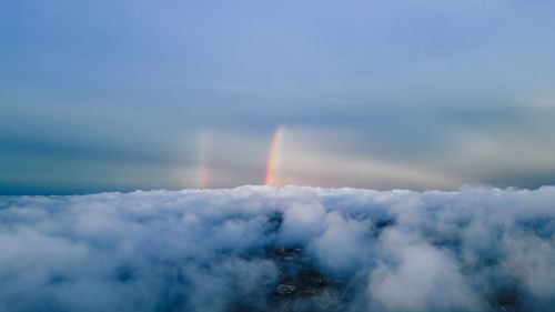 Free Stunning aerial view showcasing clouds and a vibrant rainbow over Philadelphia, PA. Stock Photo