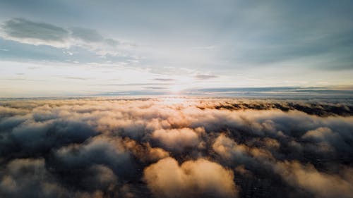 View of the Sunset from above the Clouds 