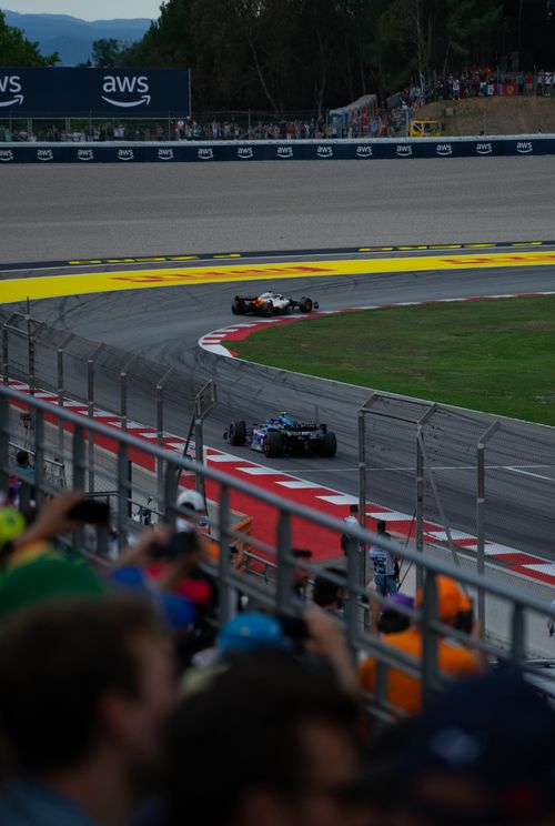 Free High-speed Formula 1 race showcasing thrilling turns at Barcelona circuit, Spain. Stock Photo