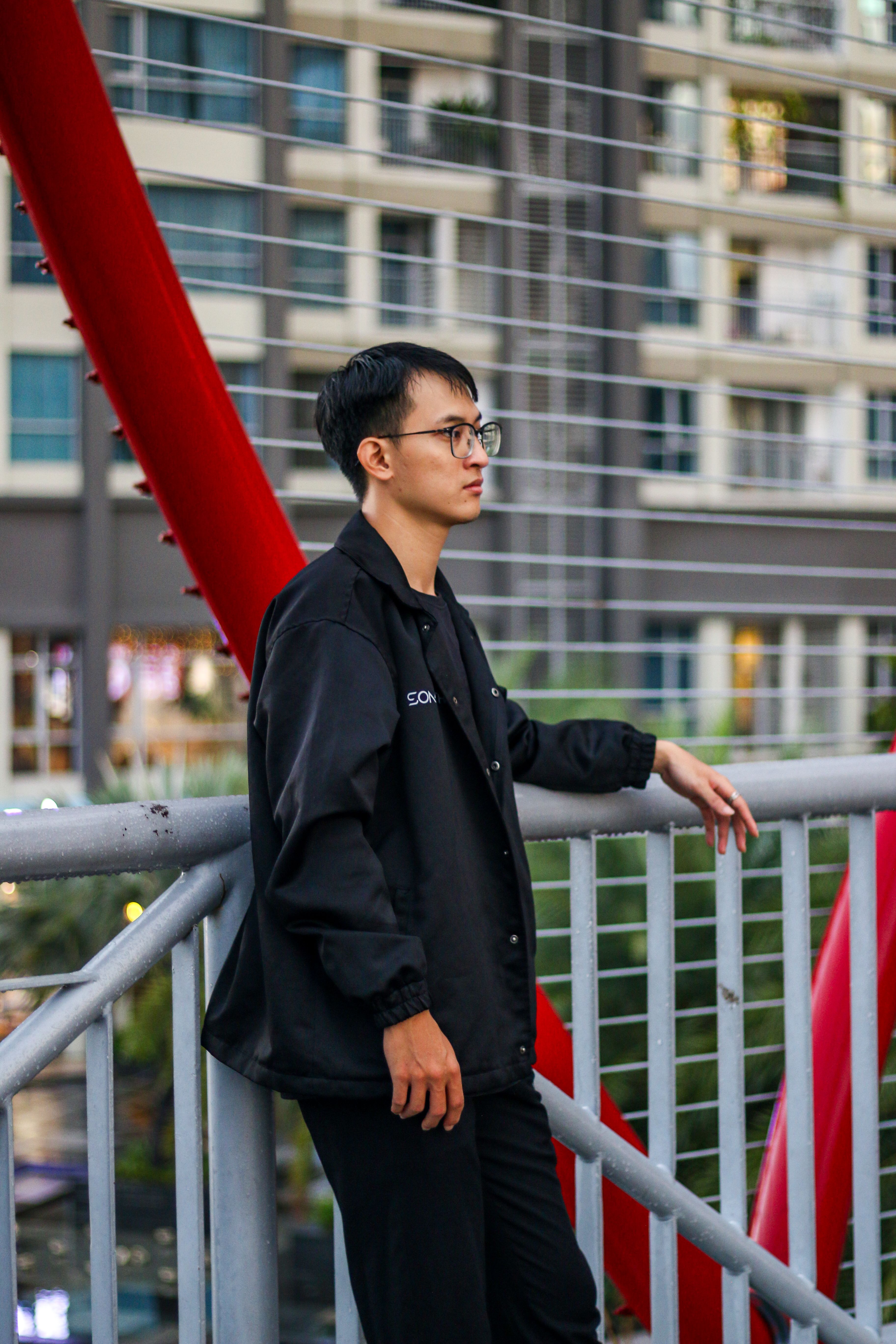 Man Standing on a Modern Bridge · Free Stock Photo