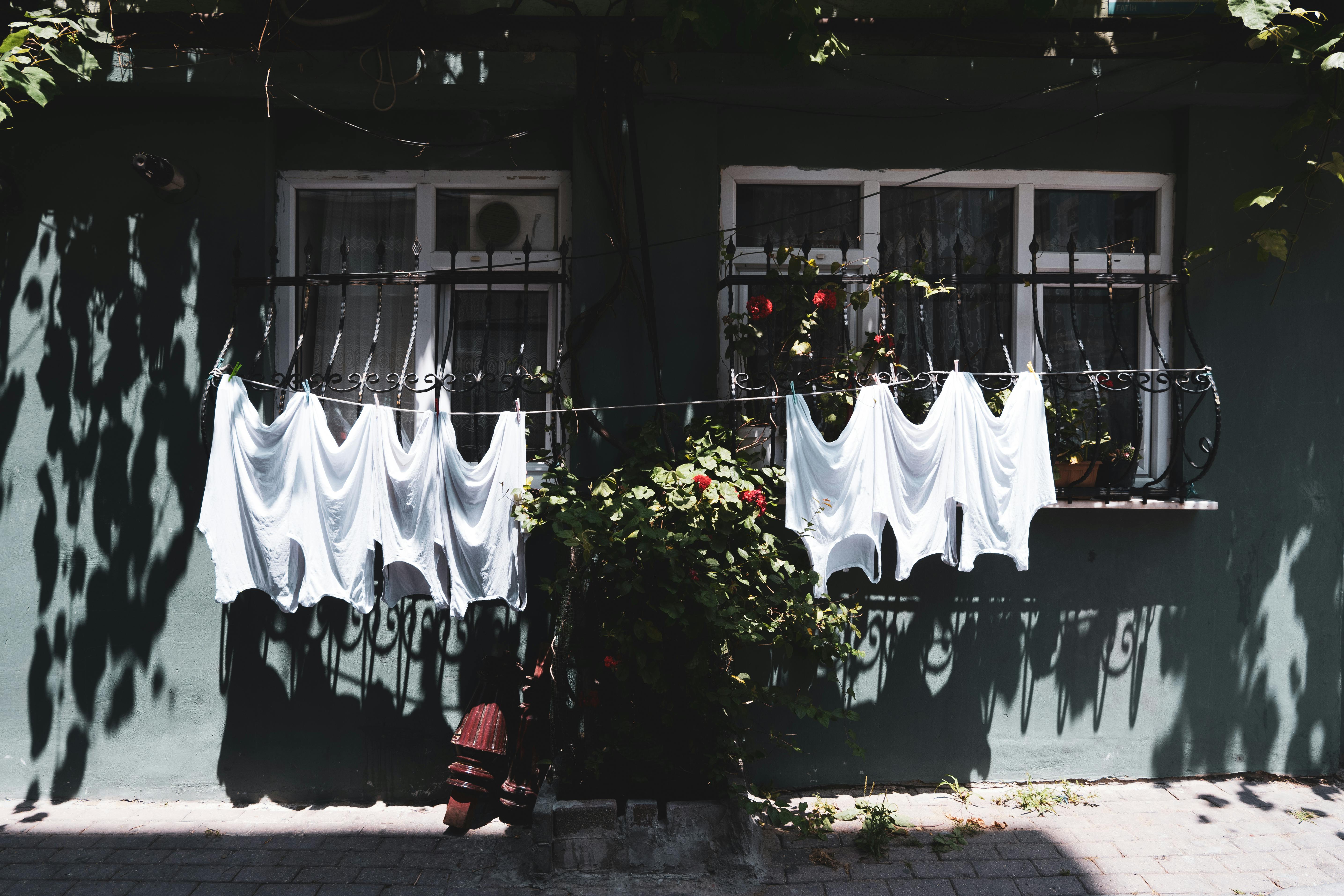 Clothes Hanging on Clotheslines outside Houses · Free Stock Photo