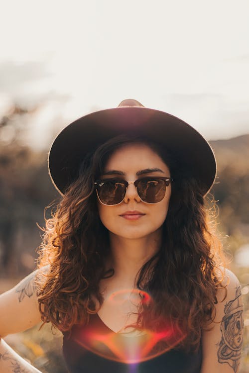 Portrait of Woman in Hat and Sunglasses