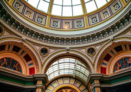 Free Close-up of ornate architectural ceiling inside London's National Gallery. Rich patterns and vivid colors. Stock Photo