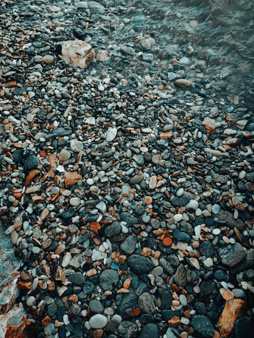 Pebbles on Ground on Shore