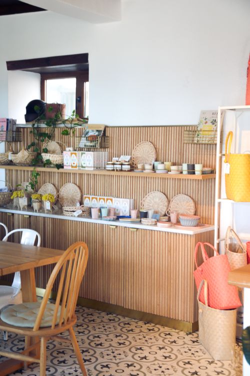 Free Modern kitchen setup featuring wooden shelves and decorative elements. Stock Photo
