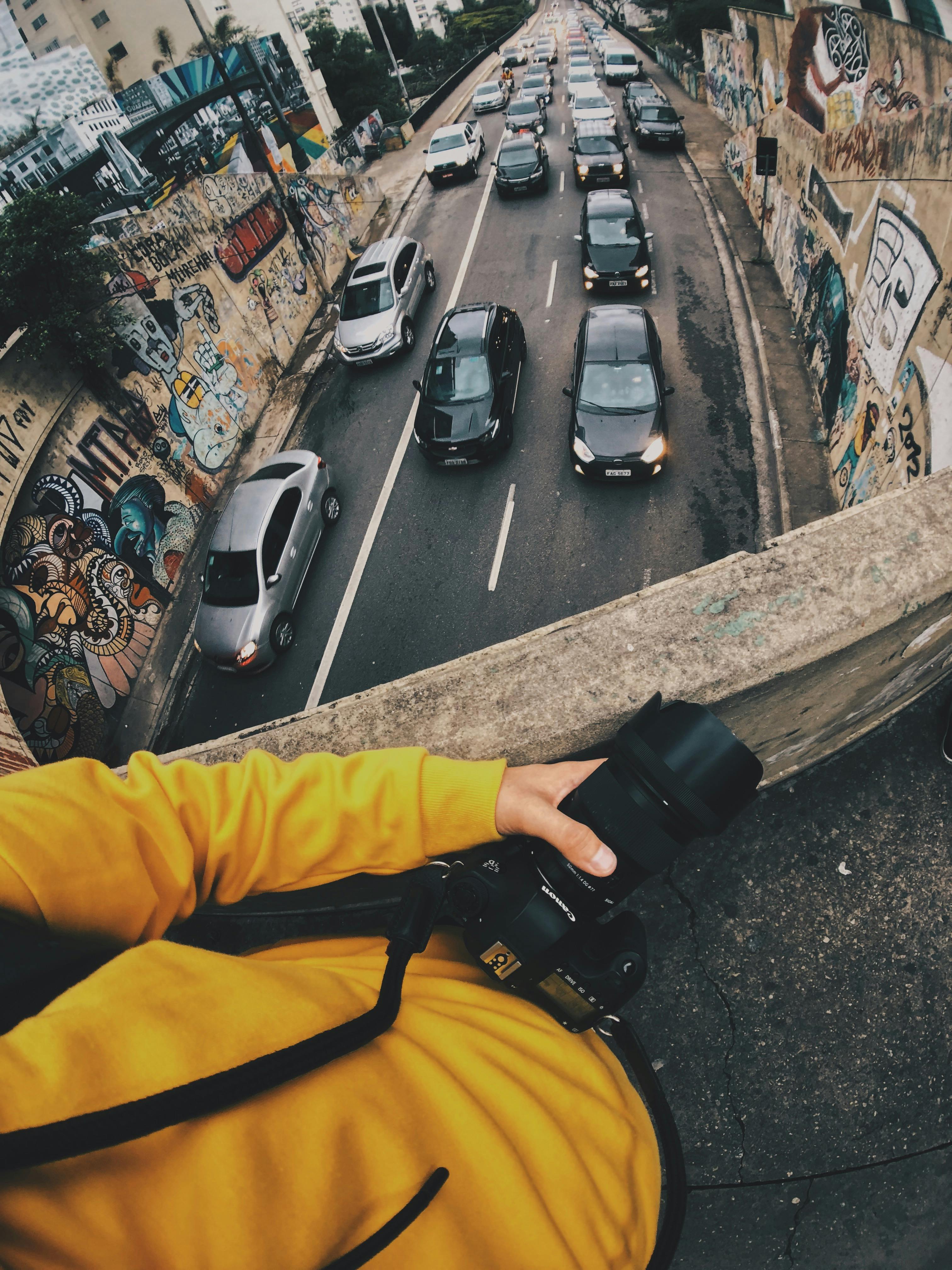 Person Holding Black Dslr Camera · Free Stock Photo