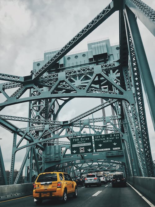 Yellow Suv on Bridge