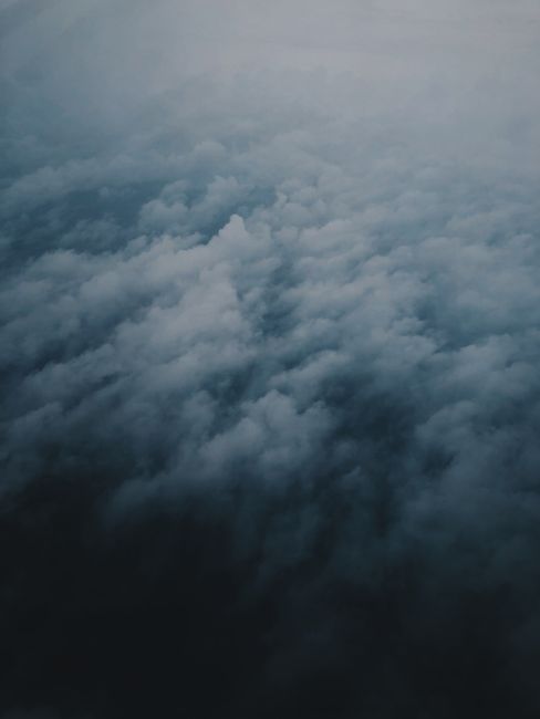 A stunning aerial view of dense, dramatic clouds creating a moody atmosphere.
