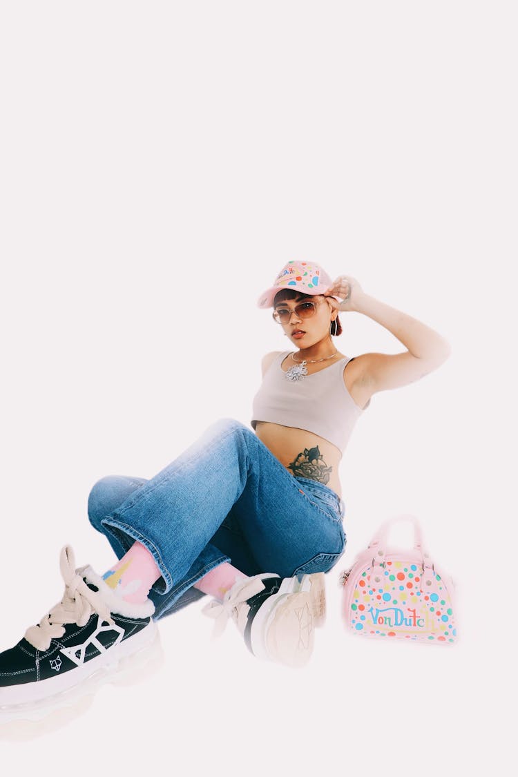 Woman Posing In Multi Colored Spotted Cap