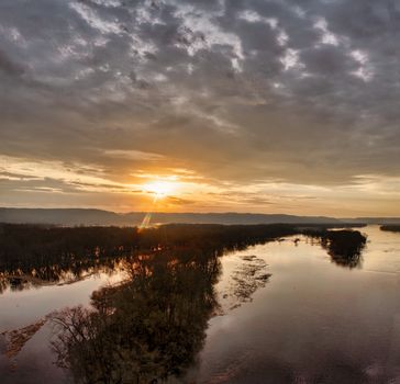 A breathtaking aerial view of sunrise over the Mississippi River near Wabasha, MN, showcasing serene nature.