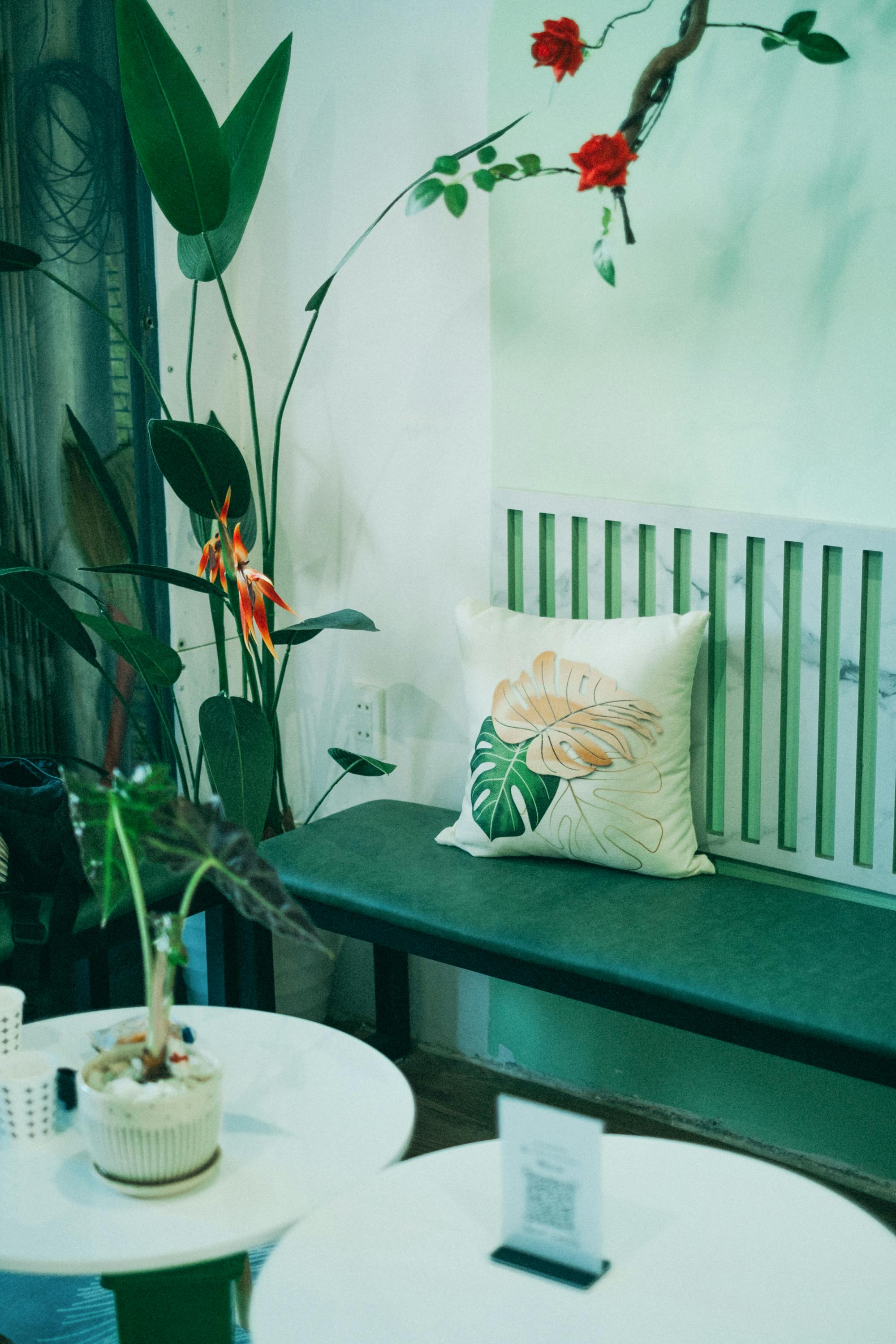 Pillow on Bench near Tables · Free Stock Photo