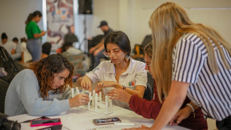 Young Women Working With Paper At A Handcraft Class