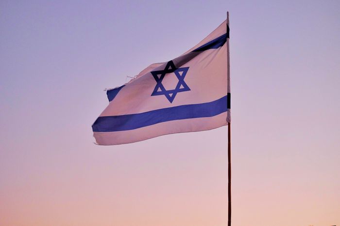 Israeli flag against the sky