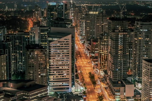 Free Stunning aerial view of Toronto's illuminated cityscape at night showcasing urban architecture. Stock Photo