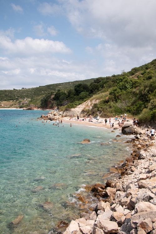 Free Picturesque beach in Vlorë County with clear waters and rocky shore. Stock Photo