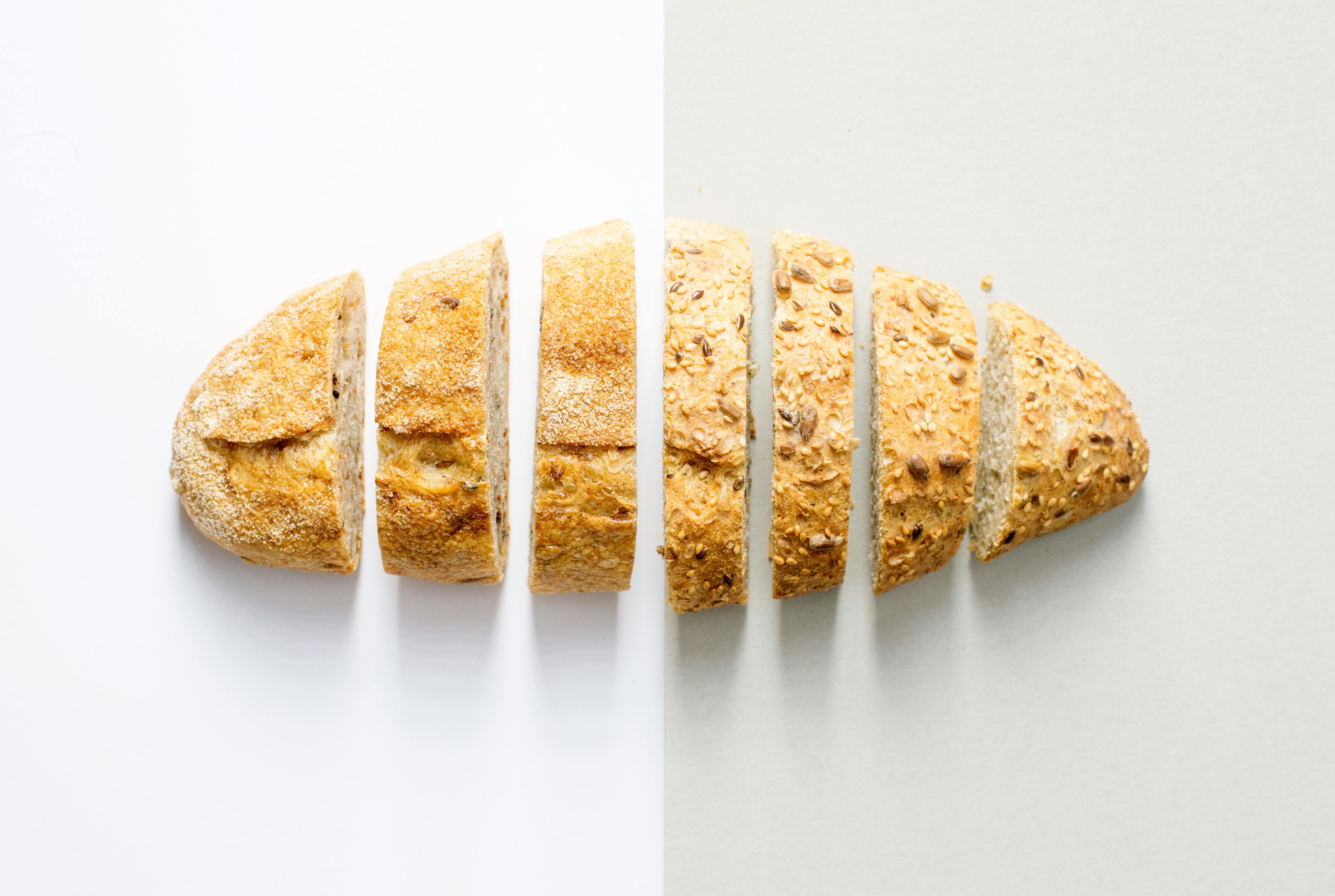 Various of breads on the wooden table background. Food and bakery concept.  Full of breads theme. Generative AI 23904832 Stock Photo at Vecteezy