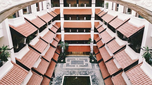 Architectural shot of a modern building with red tiled roofs in Jogja, Indonesia.