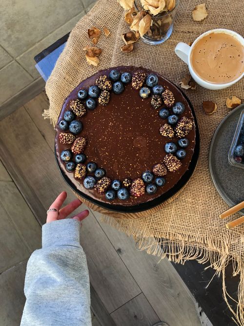 Free Chocolate cake topped with blueberries, perfect dessert setting in İstanbul café. Stock Photo