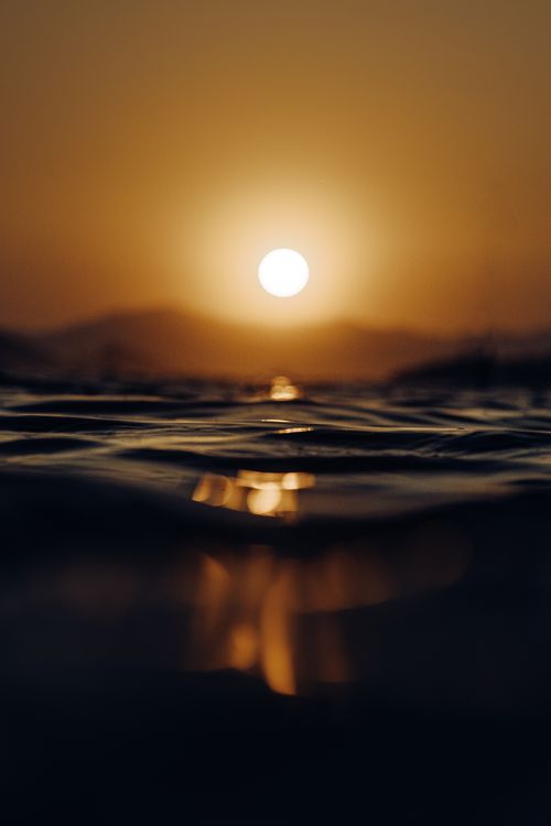 Free Stunning sunset view with golden hues reflecting on the Aegean Sea in Fethiye, Türkiye. Stock Photo