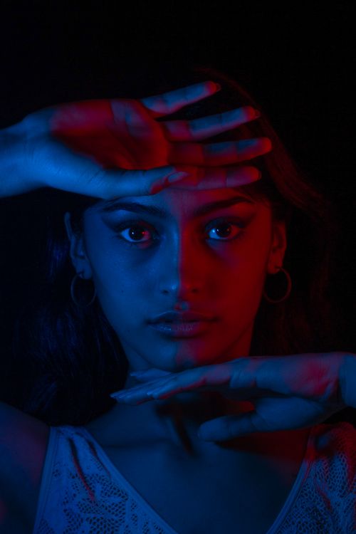 Portrait of a Woman in a Dark Room · Free Stock Photo