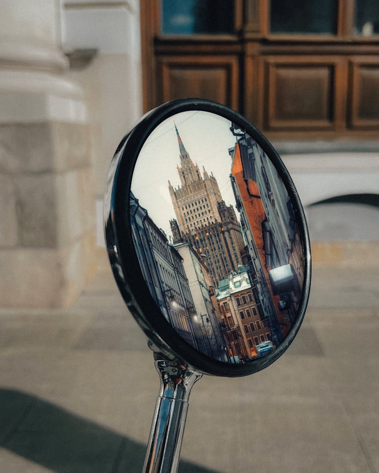 Skyscraper Reflection In Motorbike Mirror