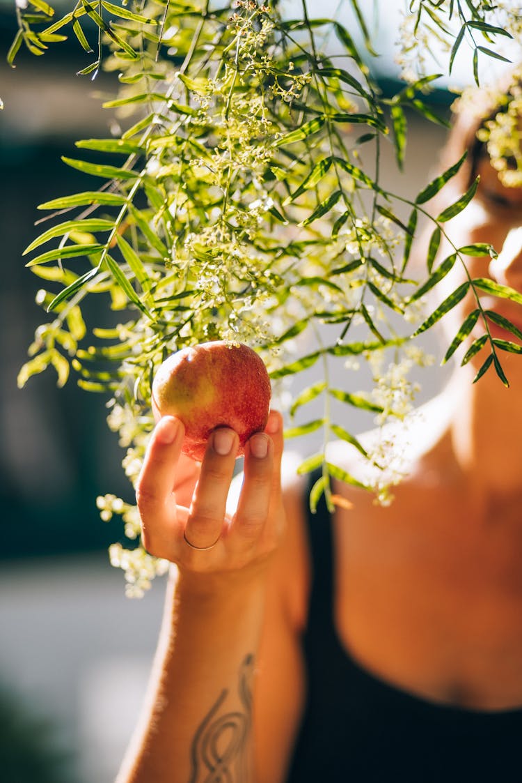 Woman Holding An Apple