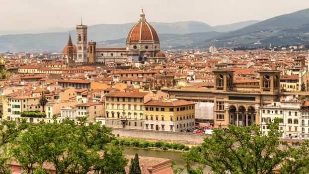 Stunning aerial view of Florence showcasing the iconic Duomo and historic cityscape during the day.
