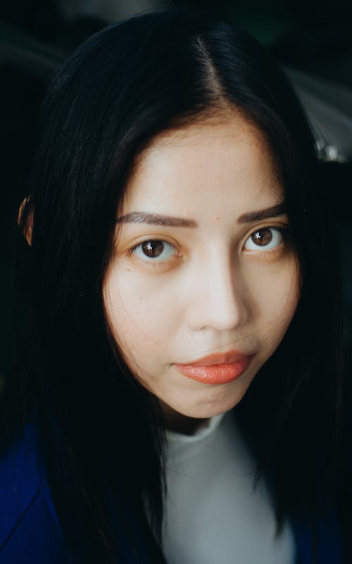 A Portrait of a Young Woman with Long Black Hair