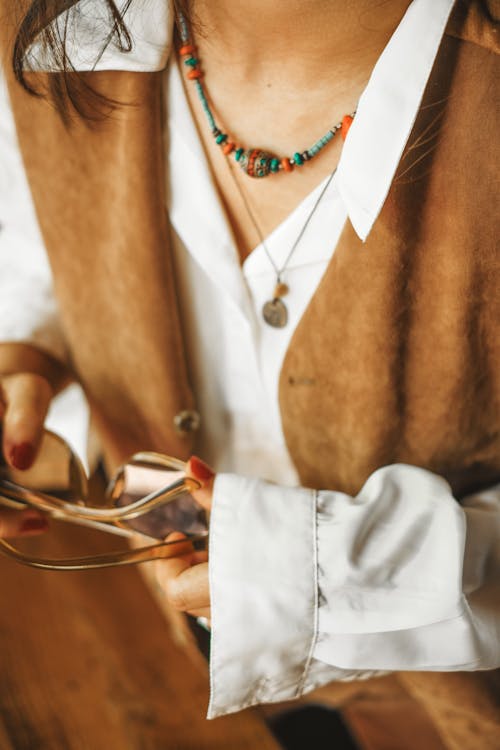 Woman in Blouse and Vest with Accessories