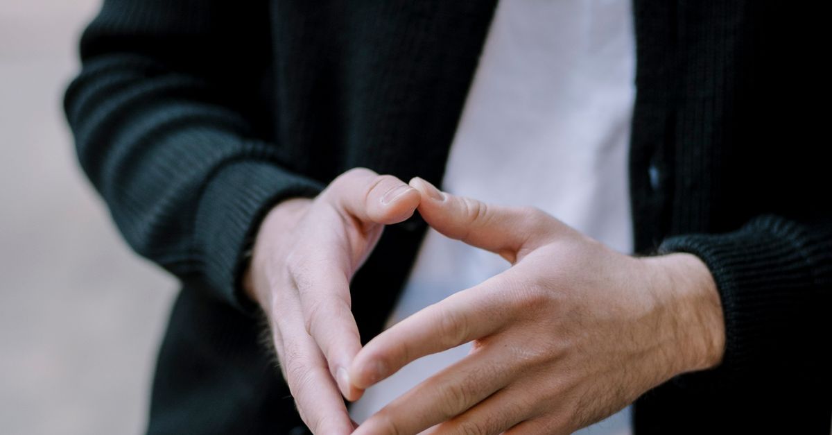 Pyramidal Hand Pyramid Hands of Person in Black Jacket · Free Stock Photo