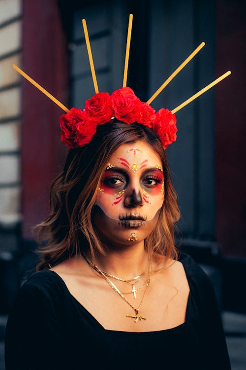 Premium Photo  Halloween costume and makeup portrait of catrina with hands  of fire