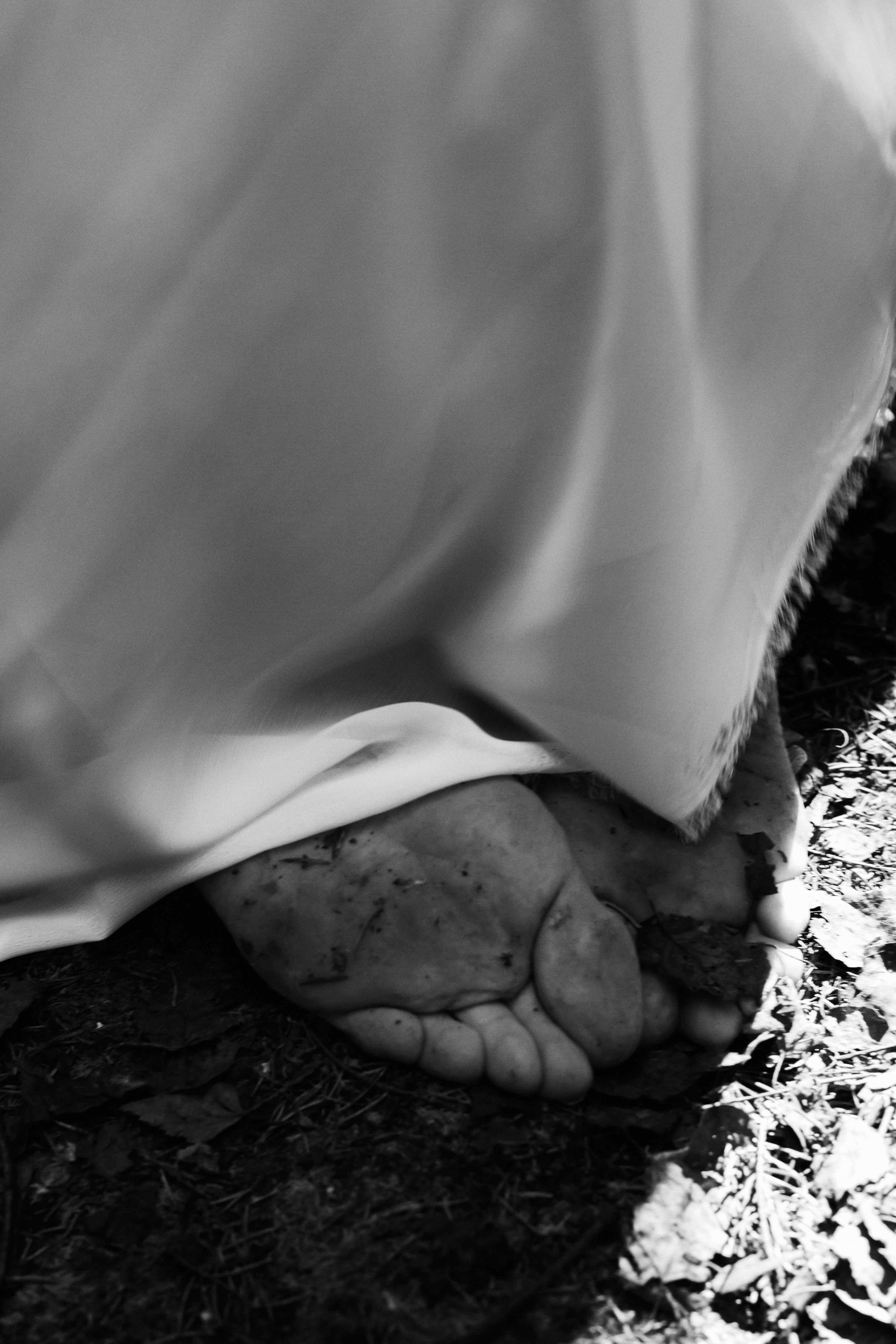 Close-up of Mans and Womans Dirty Feet Covered in Mud · Free Stock Photo