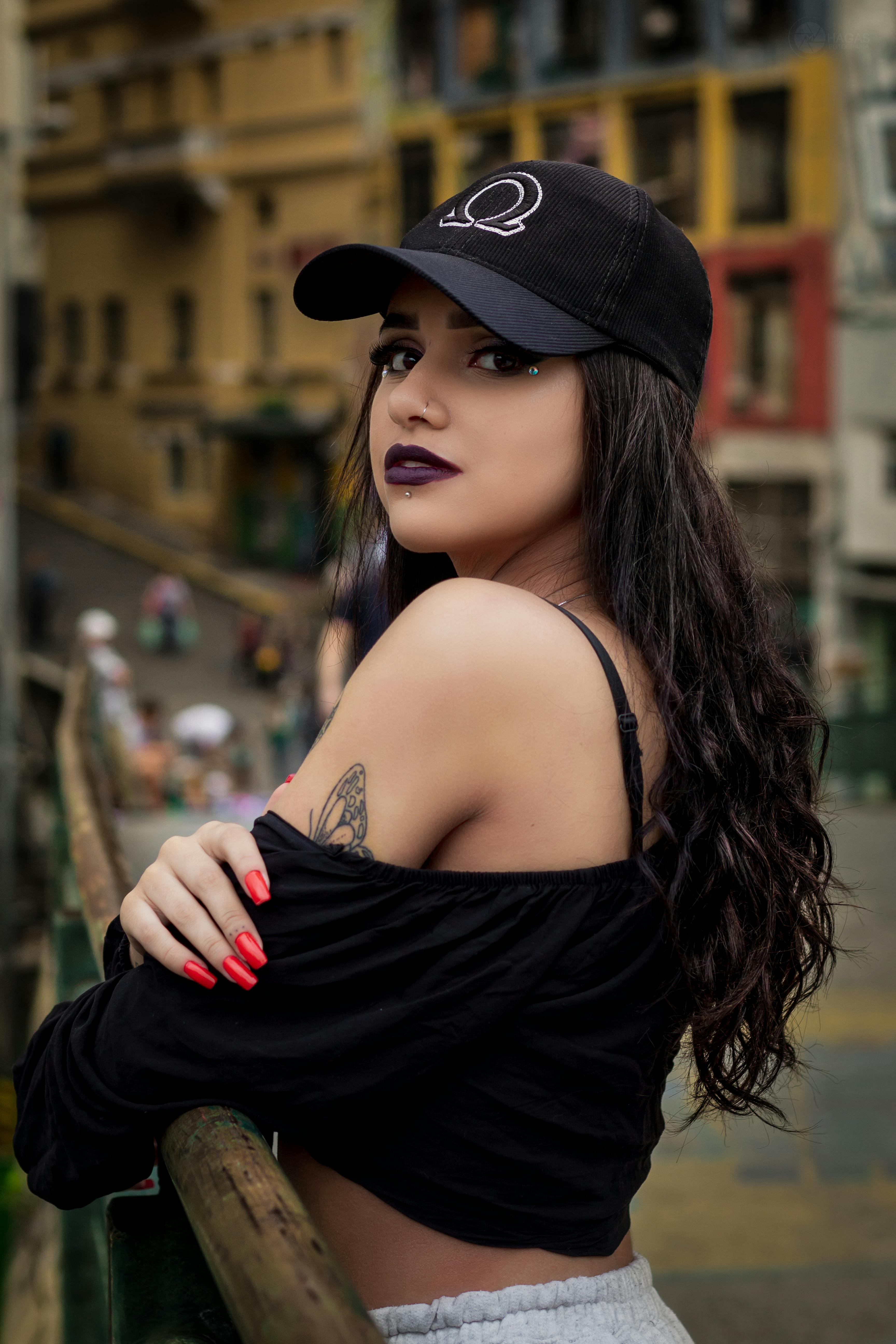 close up photo of woman wearing black cap