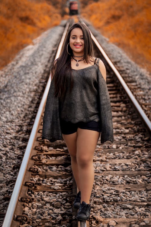 Woman Standing on Train Trail
