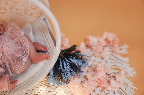 Decorations Near Newborn in Crib