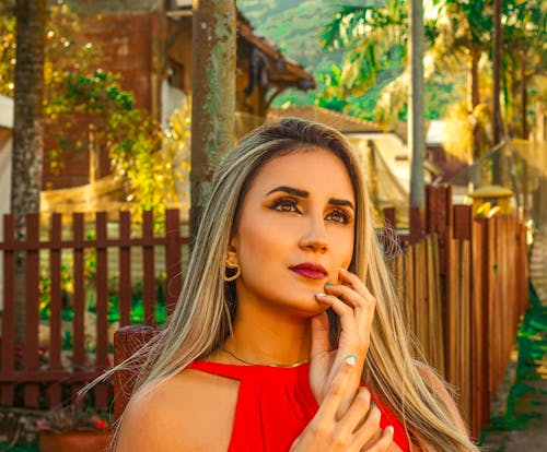 Blonde Woman in Red Dress Looking Up