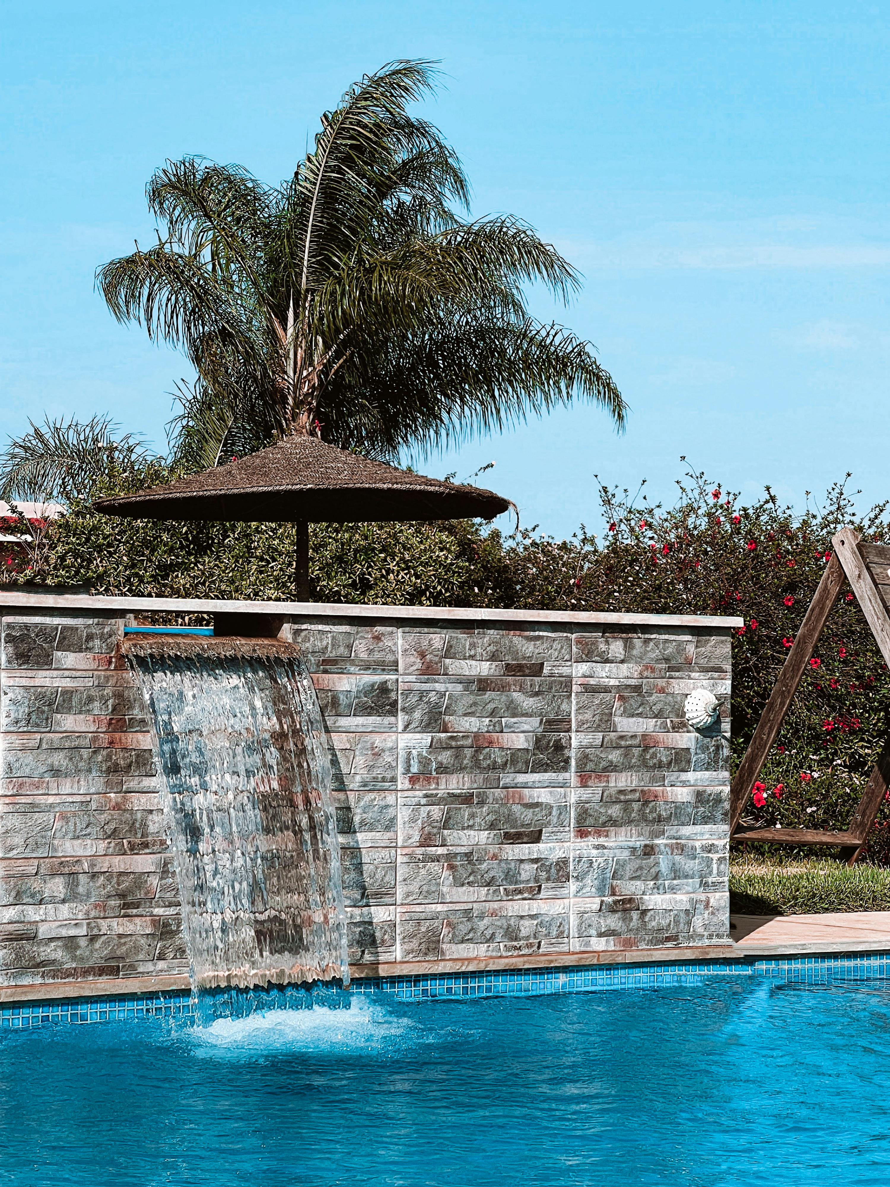 fountain and a pool at a tourist resort