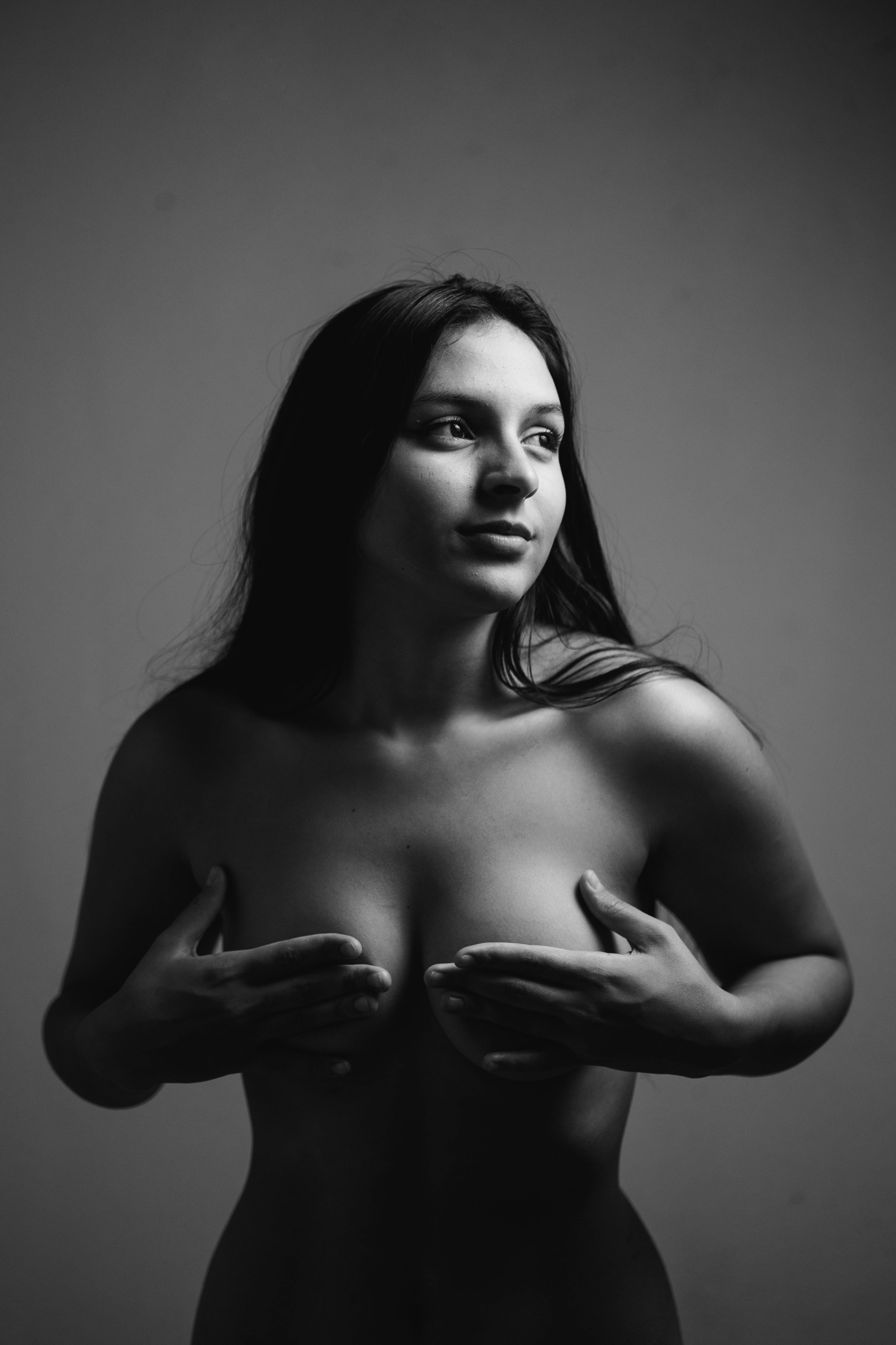 woman covering breasts Stock Photo
