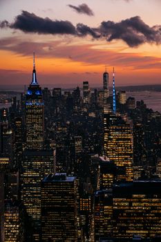 Stunning aerial view of New York City skyscrapers with a vibrant sunset sky.