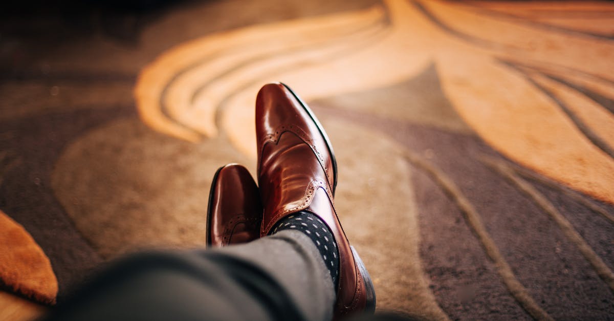 Shallow Focus Photography of Person Wearing Brown Leather Dress Shoes