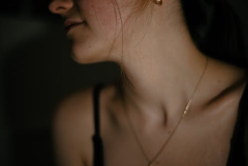 Close-up of a Young Woman Wearing a Delicate Necklace