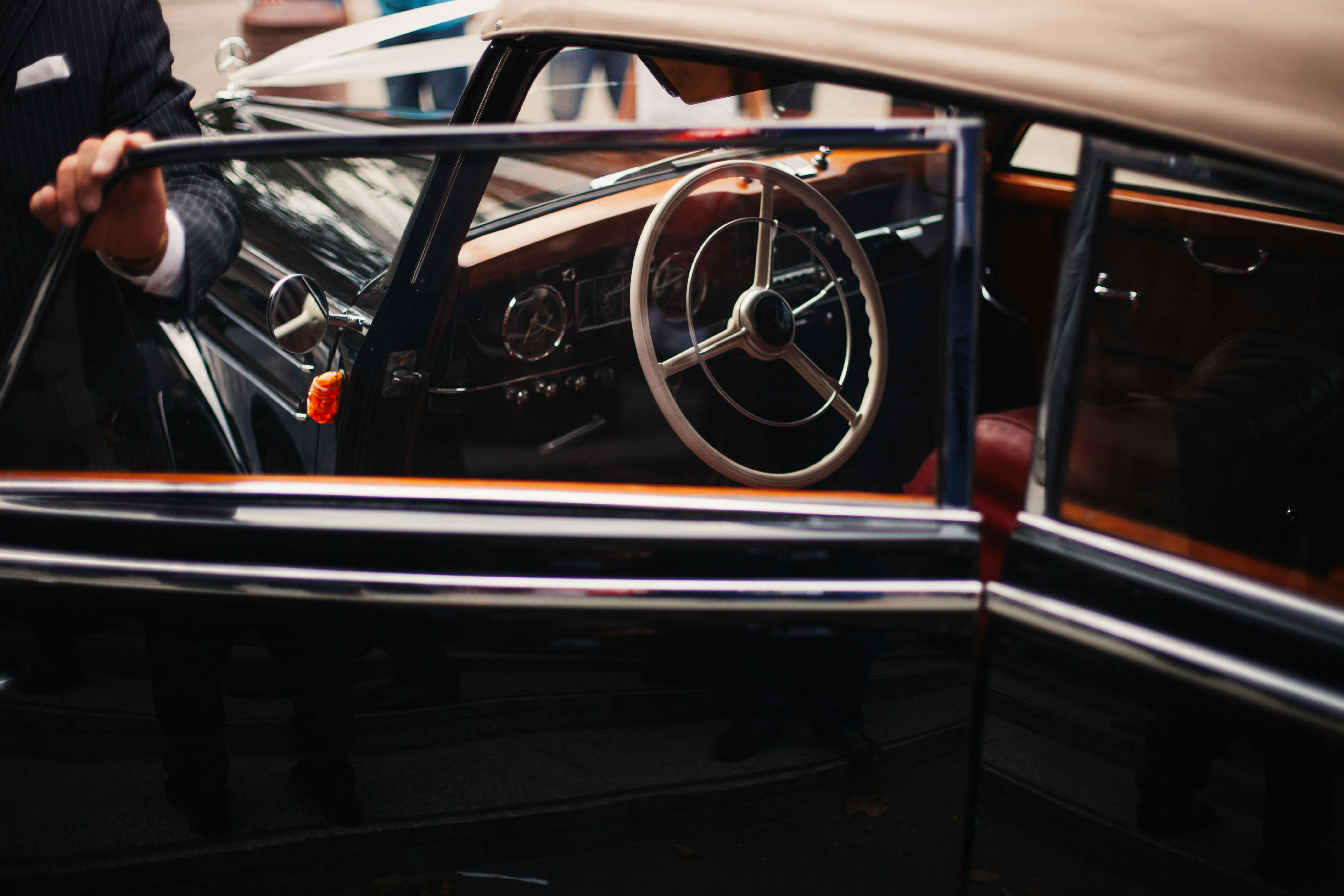 black classic car inside well lighted room