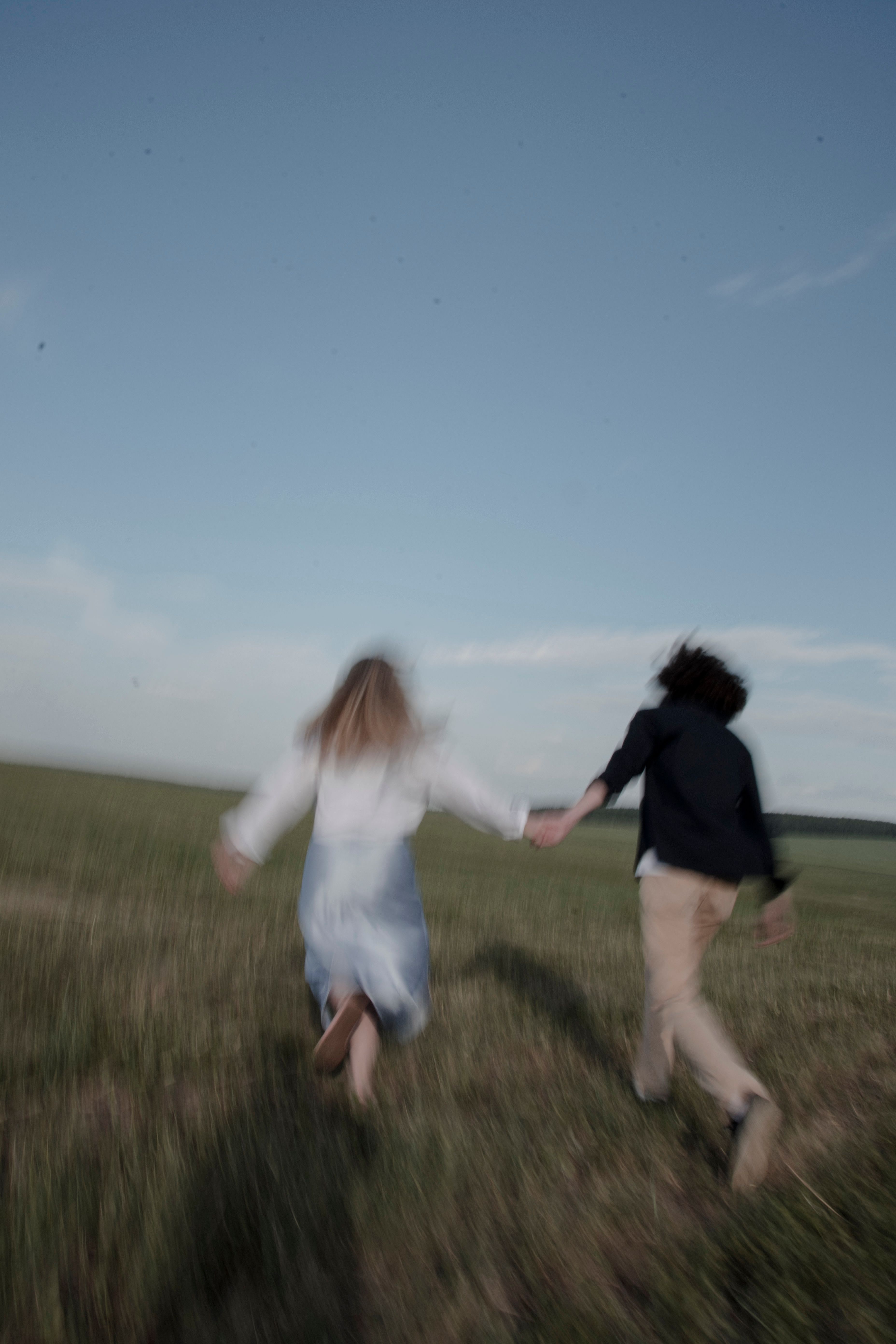 Women Running on a Field while Holding Hands · Free Stock Photo