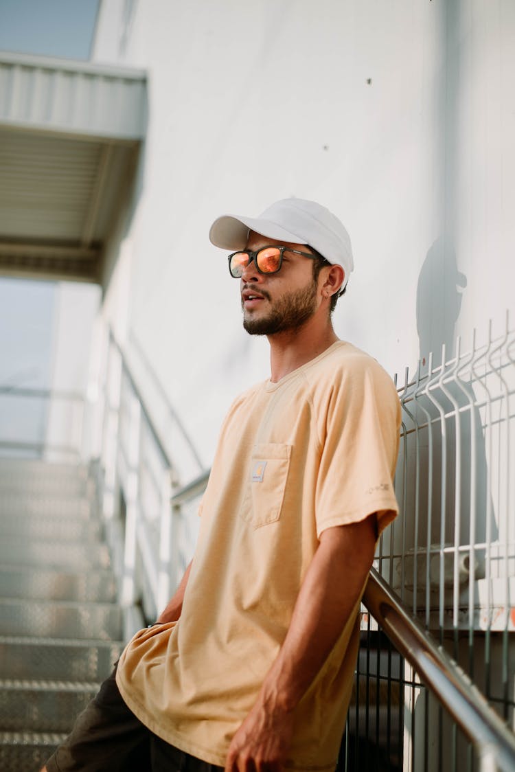 Young Bearded Man In White Cap And T-Shirt