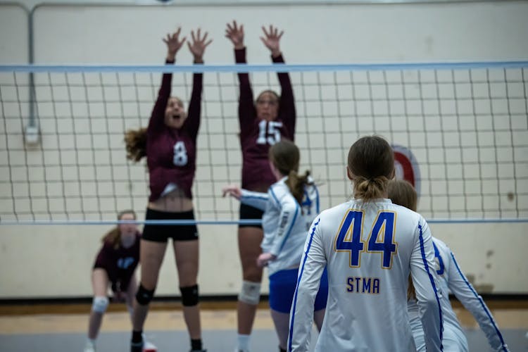 Girls Playing In A Volleyball Match 