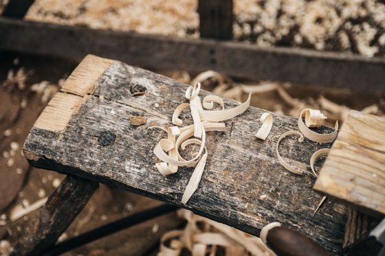 Rustic workbench covered in wood shavings, photo by Clem Onojeghuo on Pexels
