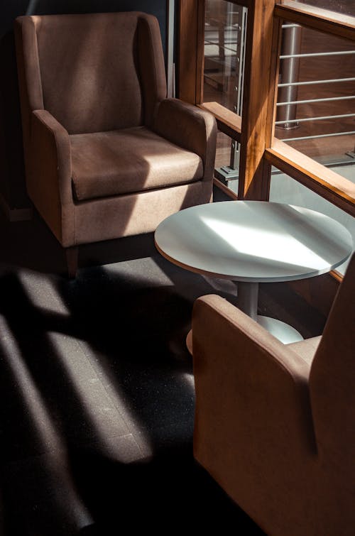 Sun Shining through the Window onto a Table and Armchairs 