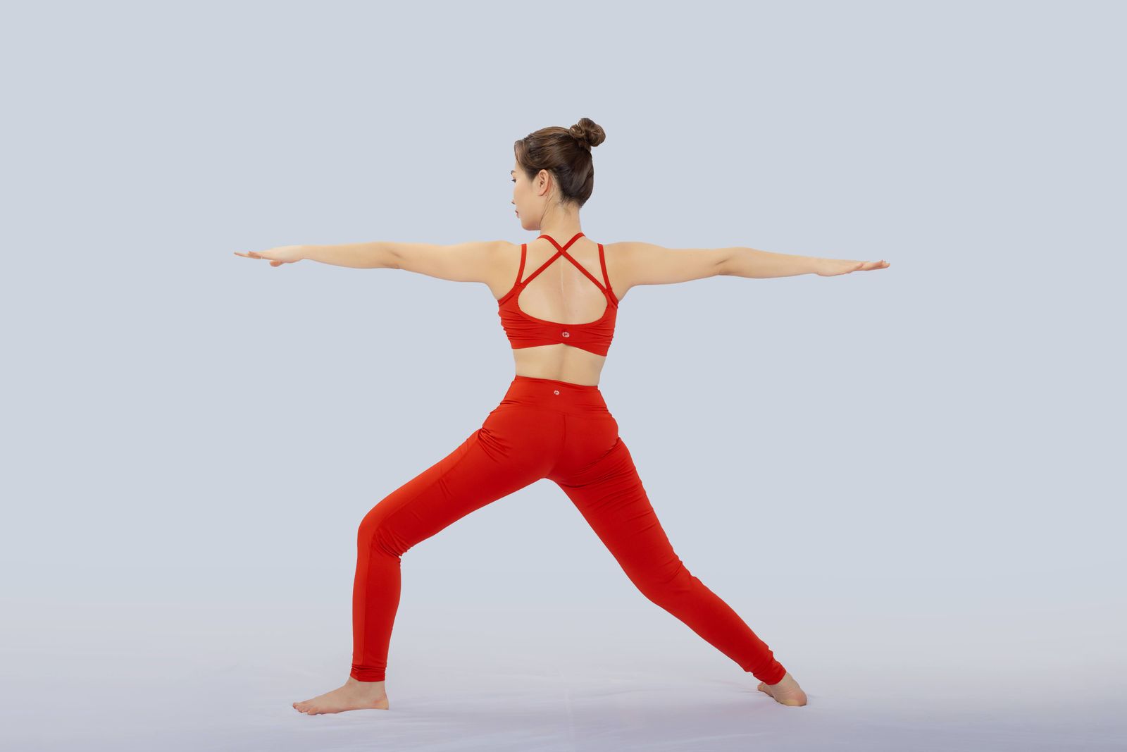 Man stretching his upper back and shoulders in a bright home workspace