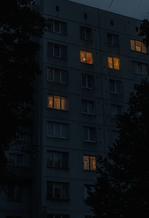 Lights in Windows of Building with Apartments
