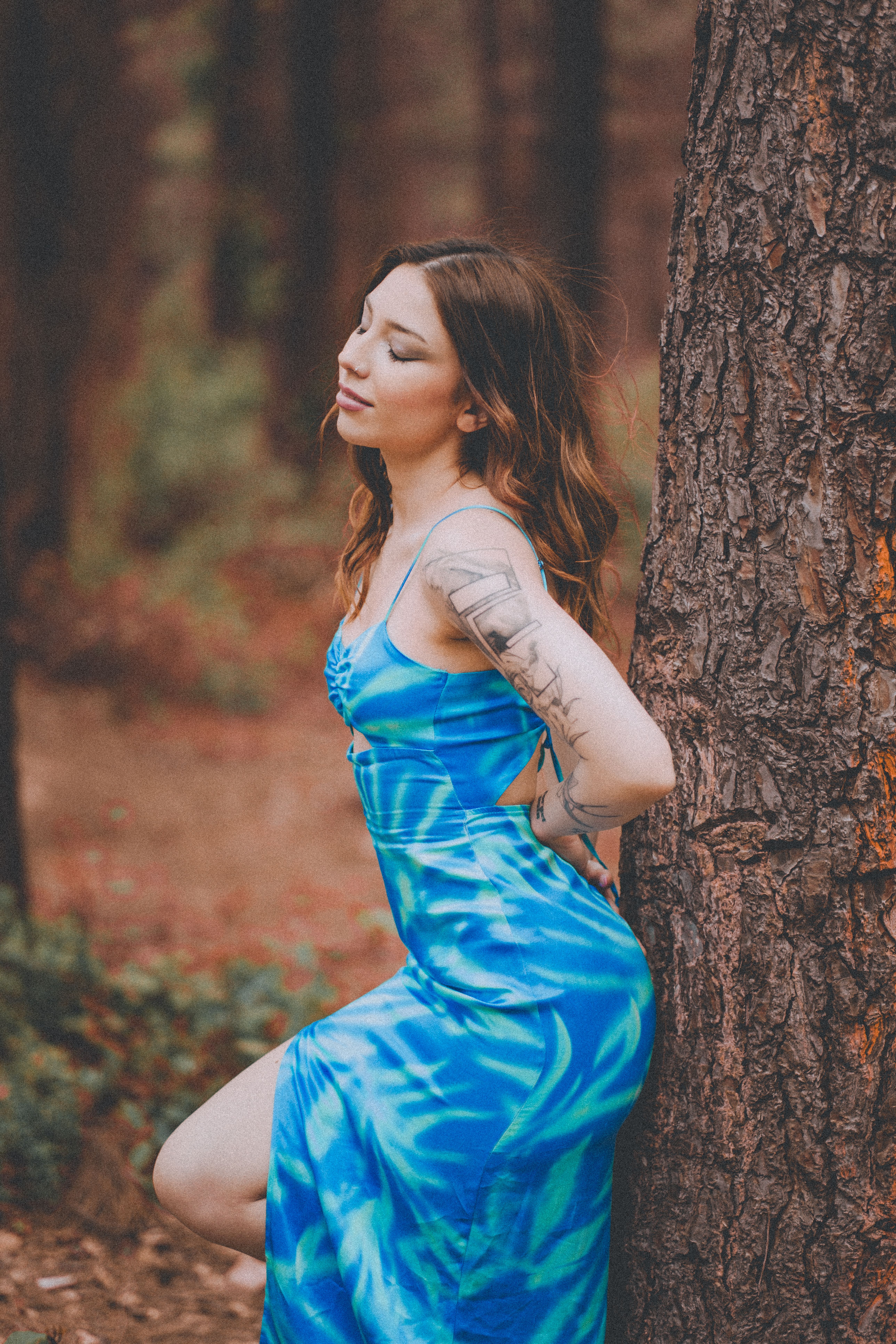 Woman in Blue Dress Leaning on Tree · Free Stock Photo